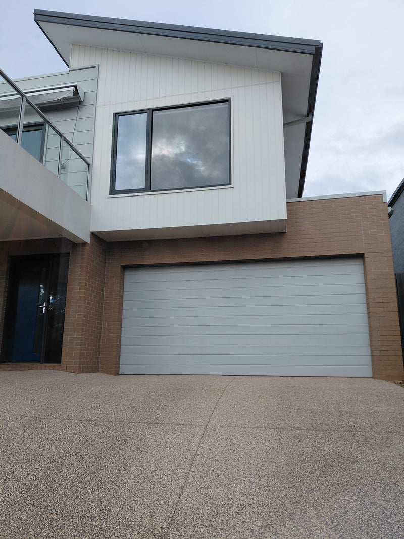 A Second-Storey Window Exploded Over the Driveway on a Weekend