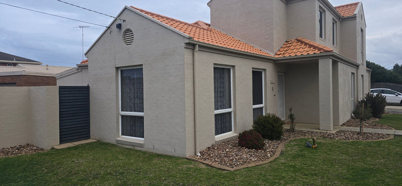 Two Awning Windows in Grey Glass, Upgraded Without Changing the Look