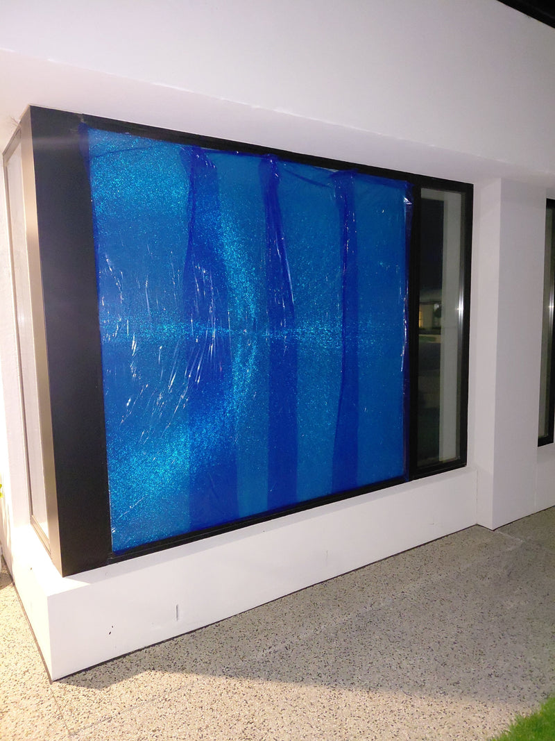A Three-Person Lift to Get a Double-Glazed Unit Back Into an Armstrong Creek Wall