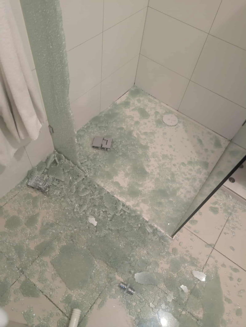 A Frameless Shower Door Came Off Its Hinges Mid-Use