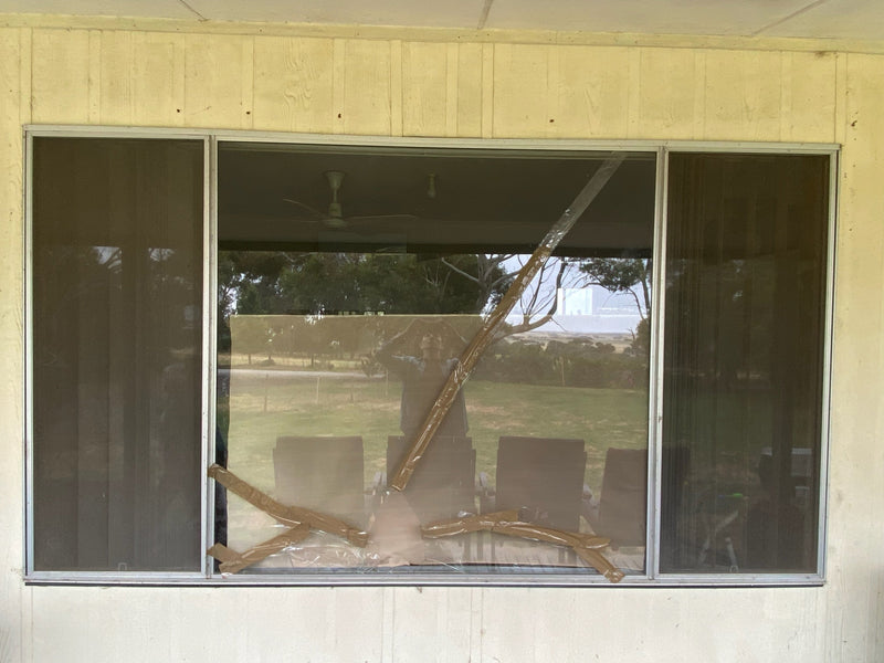 A Large Plate Glass Window That Broke Into Blades
