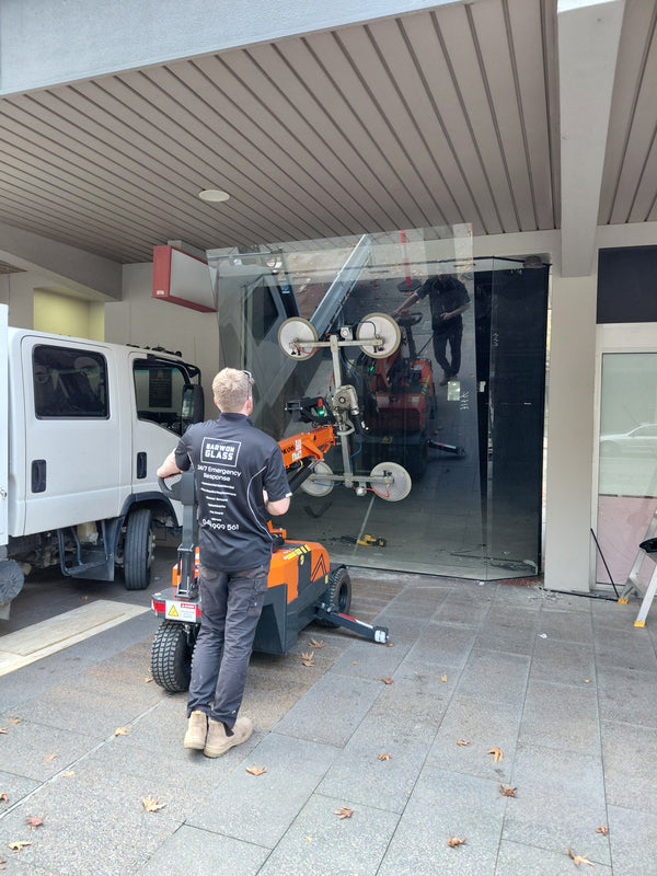 Jekko MPK06 glass lifter carrying a new display panel into the bay window at Market Square Geelong