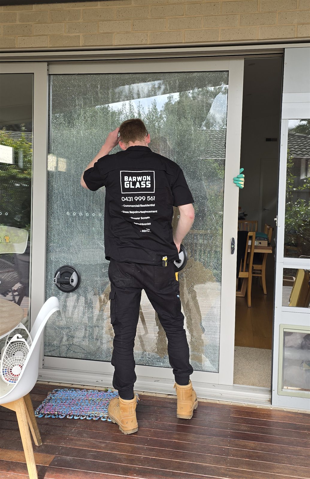 Barwon Glass technician repairing a cracked sliding glass door