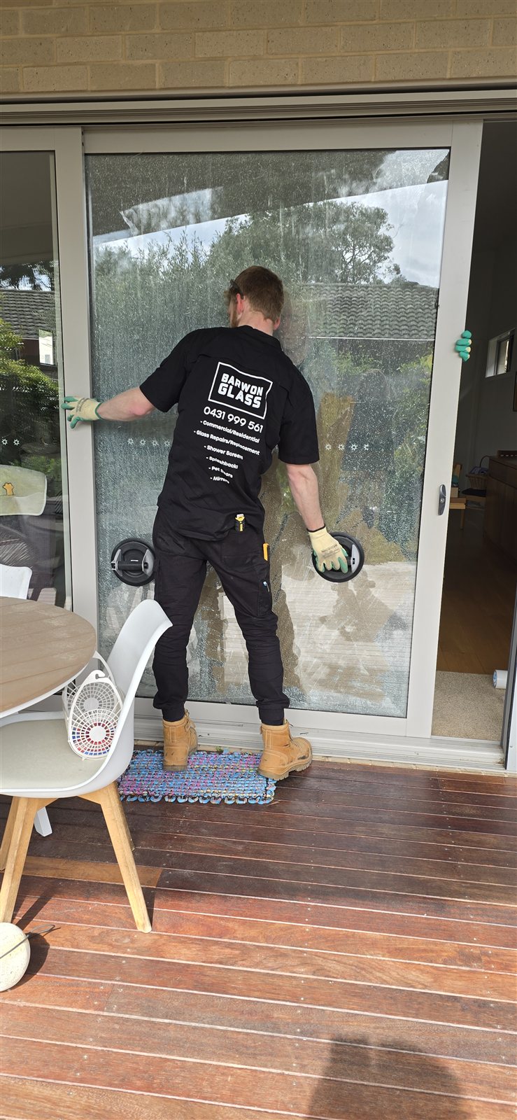 Barwon Glass crane lifting a large commercial glass panel into place